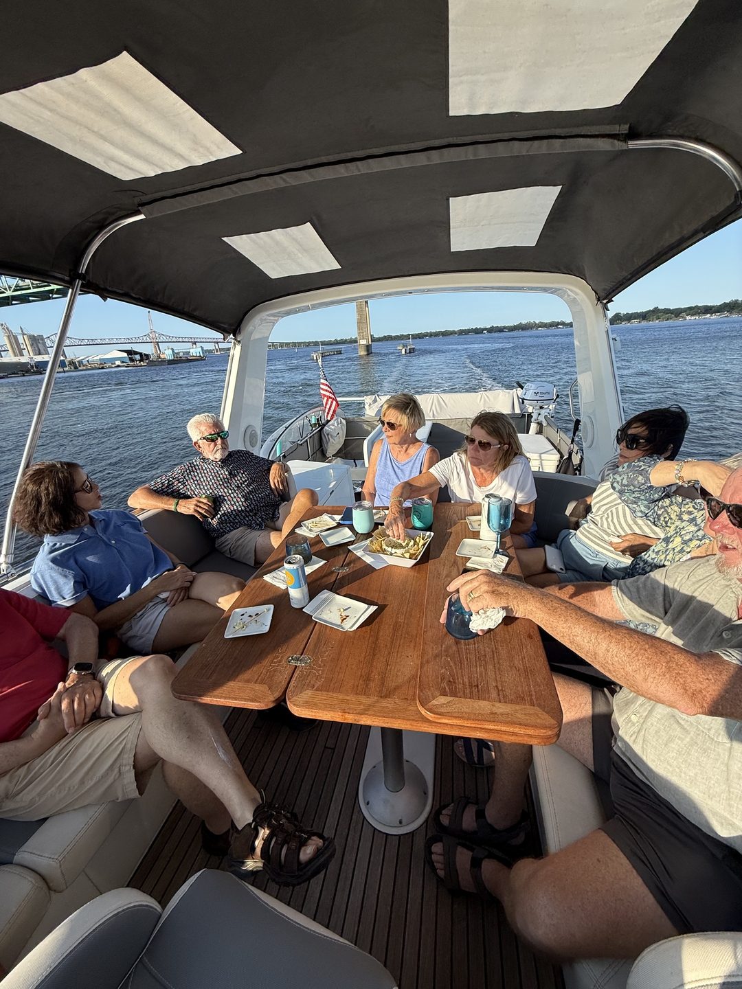 Guests dining together on VADA's aft deck under the canopy