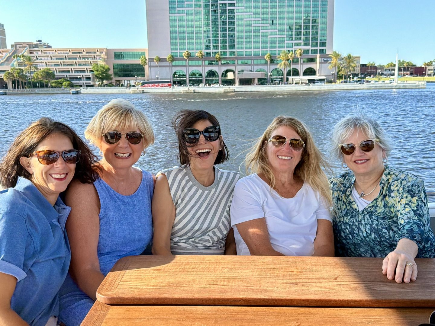 Group of friends aboard VADA with downtown Jacksonville behind