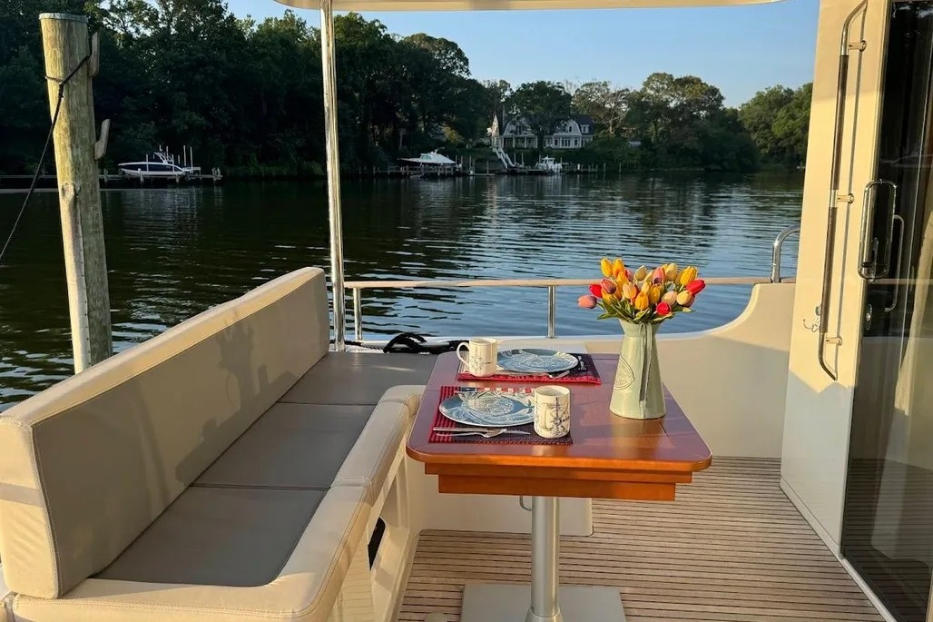 Aft deck dining with flowers aboard VADA